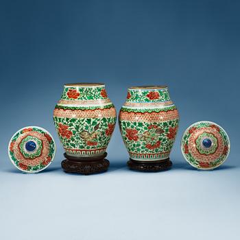 1442. A pair of Transitional wucai jars with covers, 17th Century.
