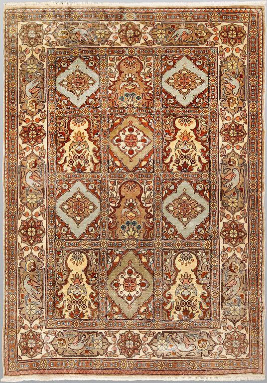 A semi-antique figural Kaysari silk carpet, approx. 100 x 70 cm.