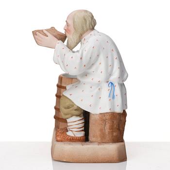 A Russian Gardner bisquit porcelain figure of a peasant, Moscow, 19th Century.