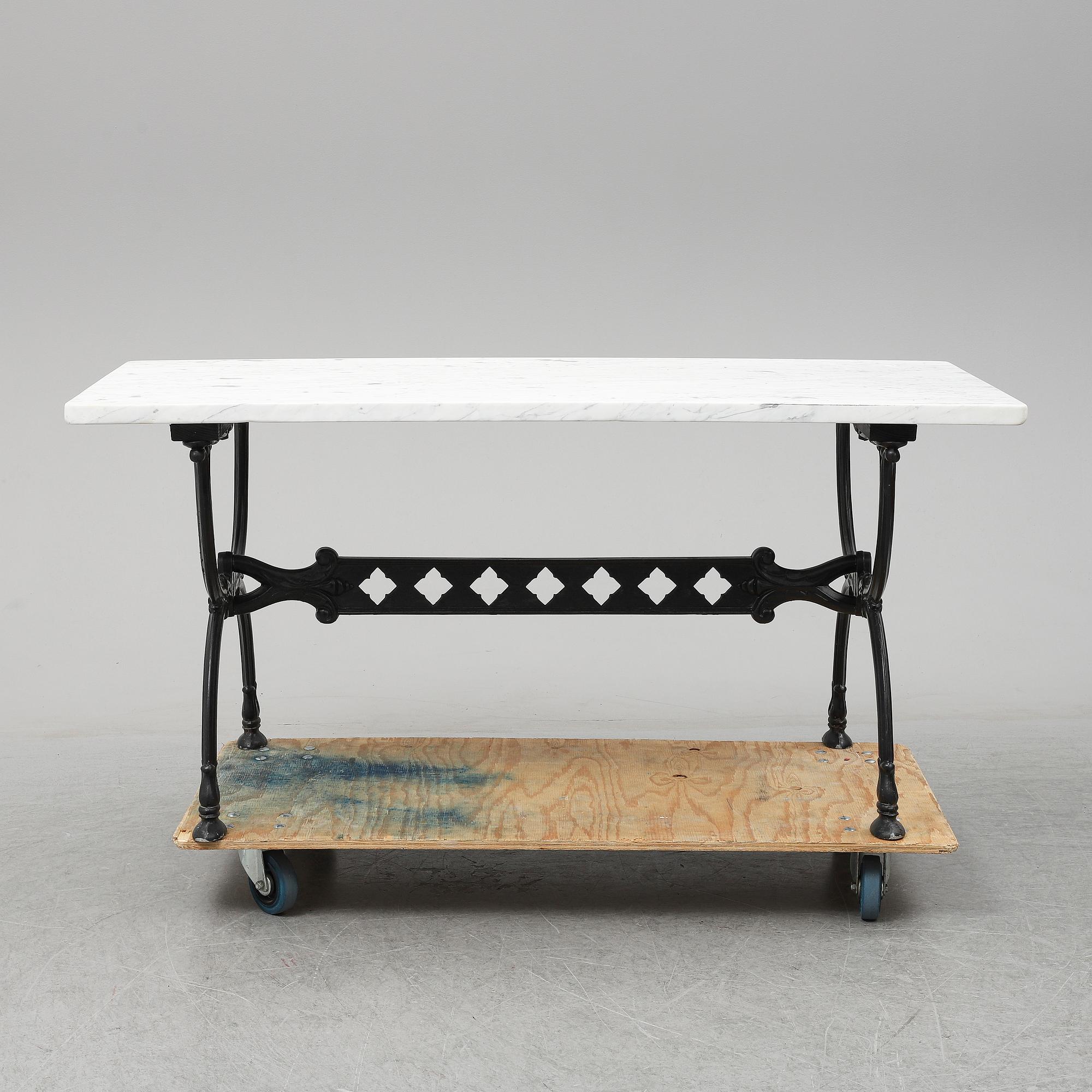 An end of the 20th Century aluminum and marble garden table.