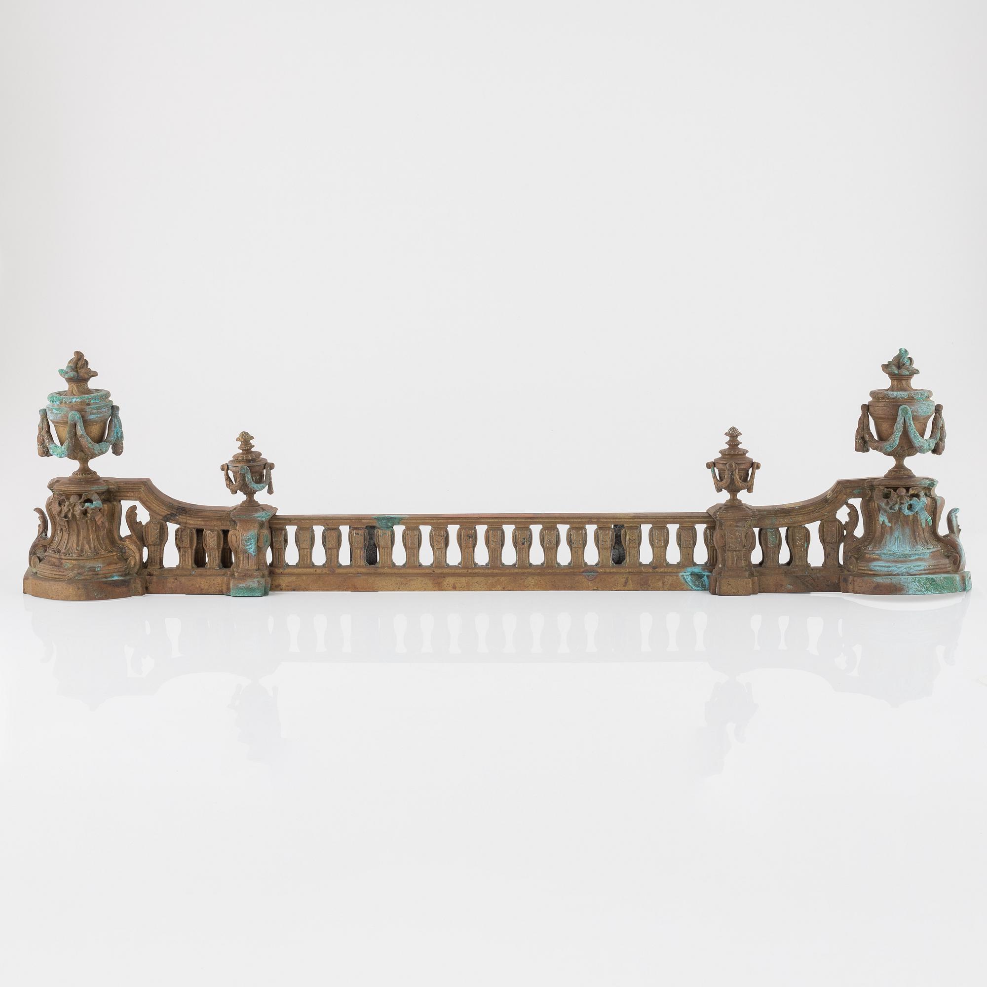 A Louis XVI style bronze grate, 19th Century.