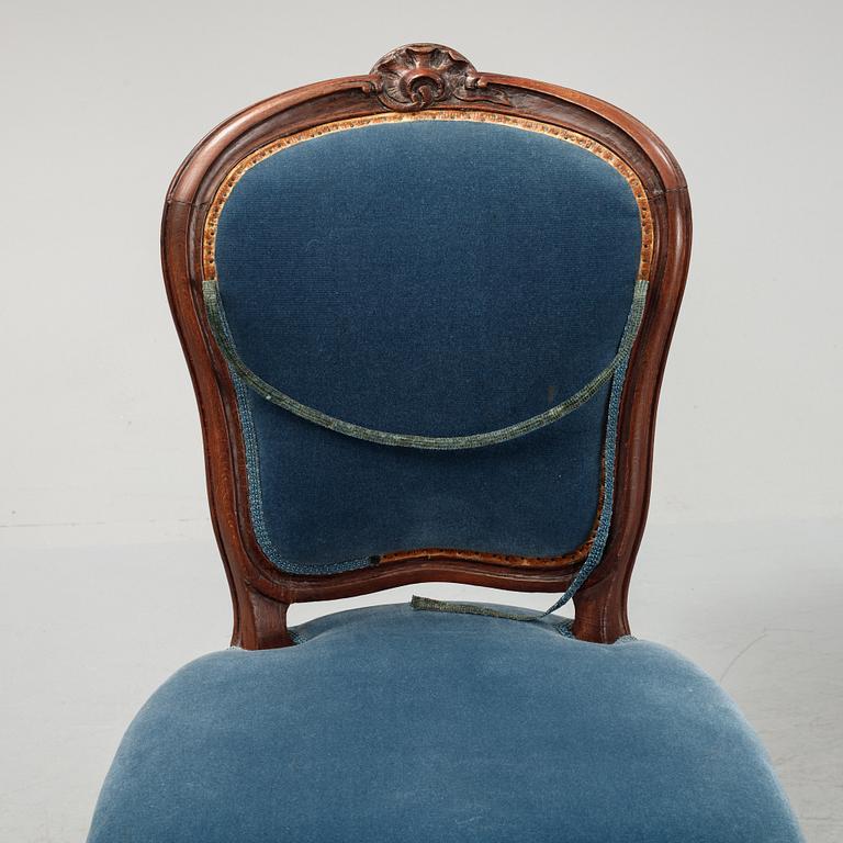 A sofa and a set of four chairs, Rococo revival, late 19th century.