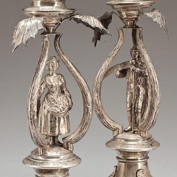 KANDELABRAR, låghaltigt silver, ett par. Polen, tidigt 1900-tal.