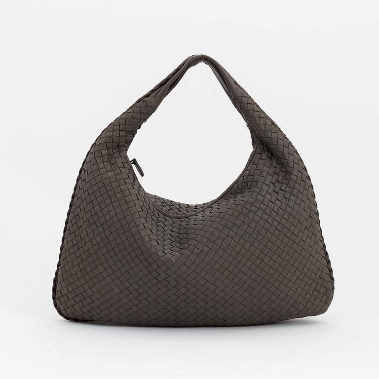 Bottega Veneta, a grey intrecciato leather bag.