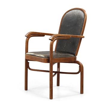 Sigurd Lewerentz, a stained beech and black leather armchair, Gemla, Sweden circa 1932.