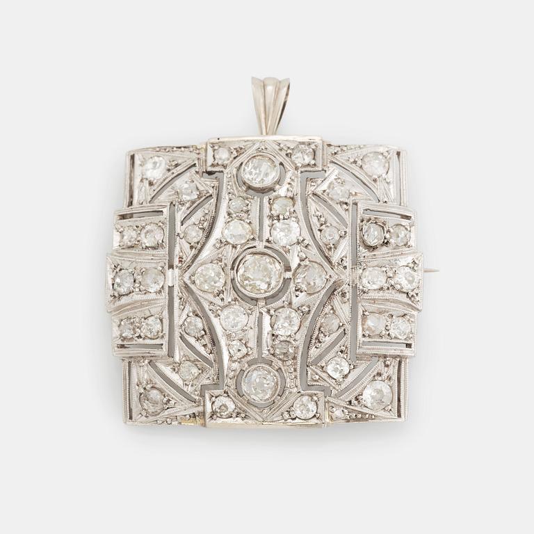 A brooch/pendant in 18K white gold set with old-cut diamonds.