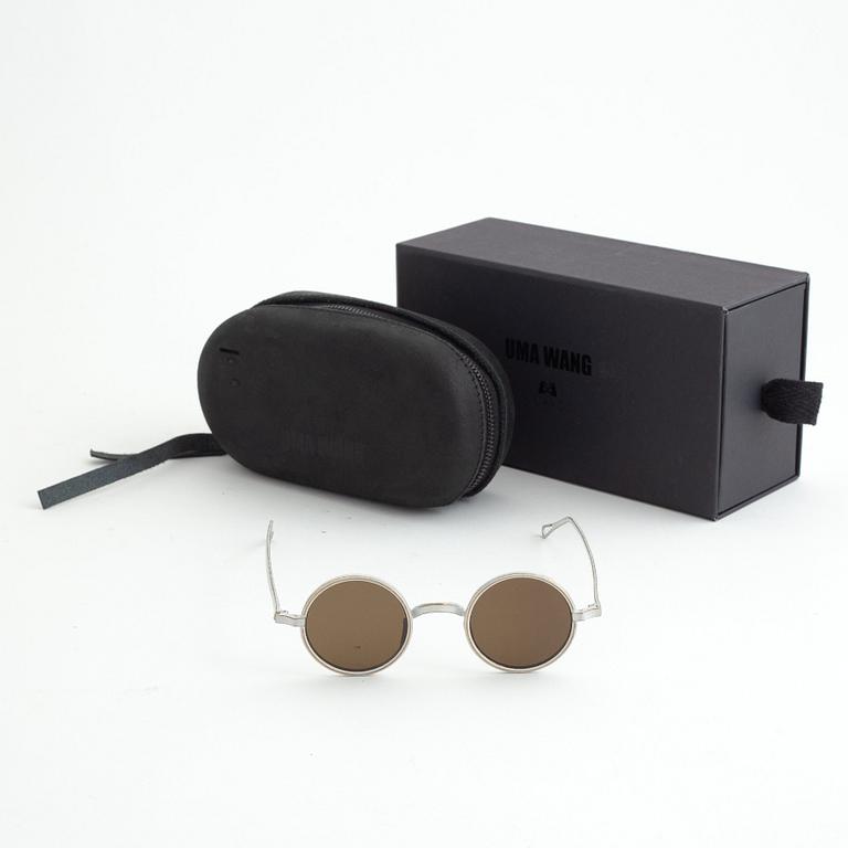 A pair of Uma Wang + Rigards, 'The Victorian', sunglasses and a Uma Wang, ipad case.