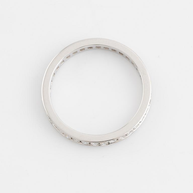 Brilliant cut diamond eternity ring.