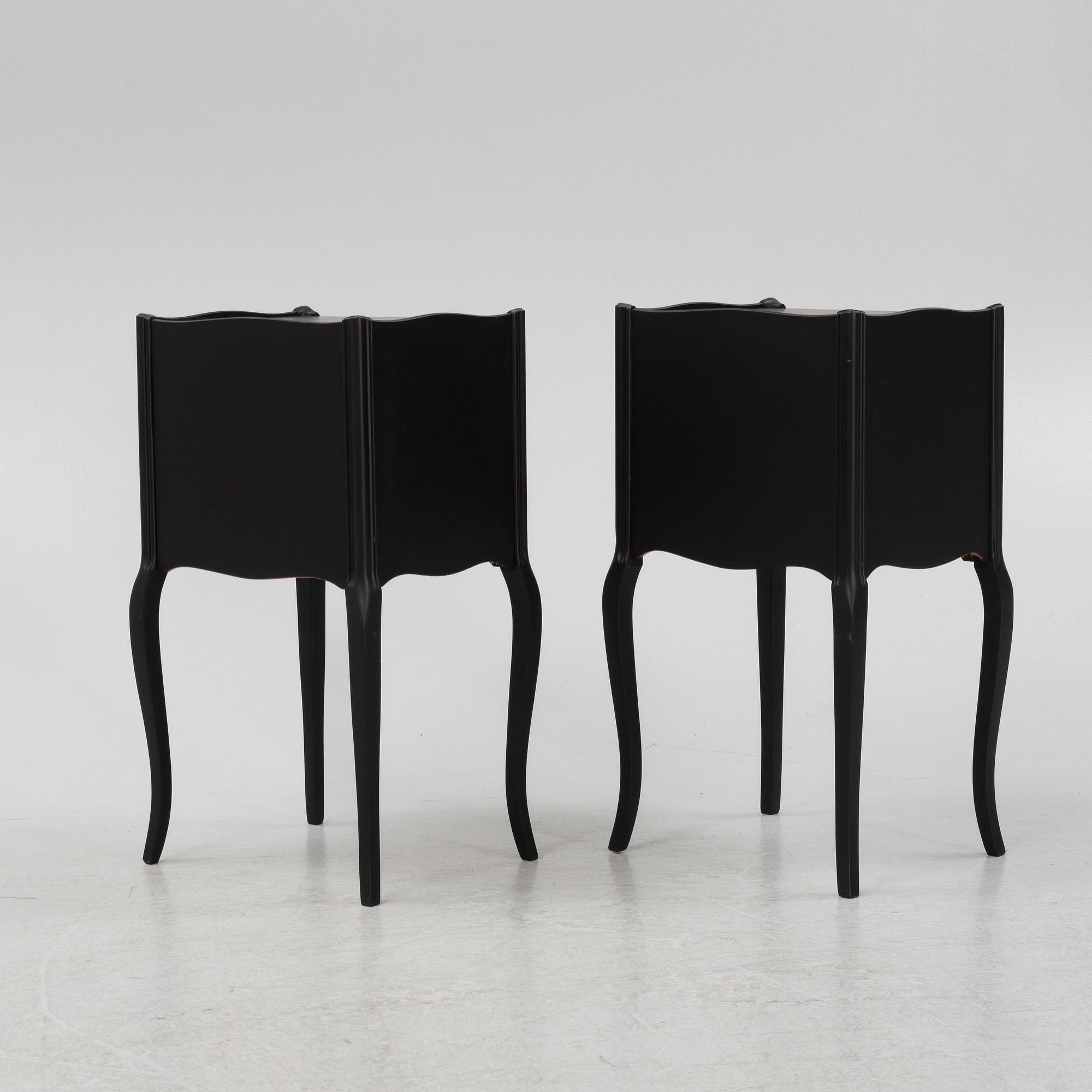A painted pair of bedside tables.