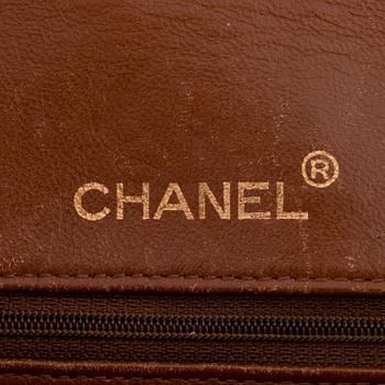 CHANEL, a quilted brown leather purse, "Flap Bag".