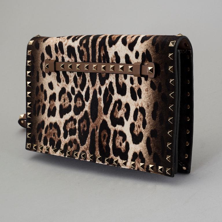 A ponyhair clutch with studs by Valentino.