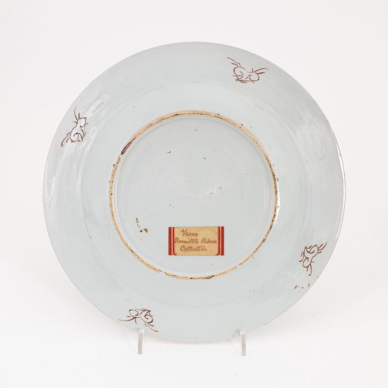 A pair of Chinese plates, a serving dish and a cream jug, Qing dynasty, 18th Century.