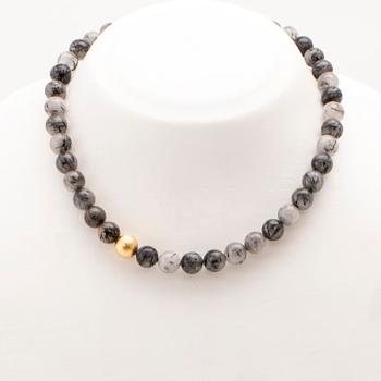 Ole Lynggaard, two necklaces and clasp in 18K gold.