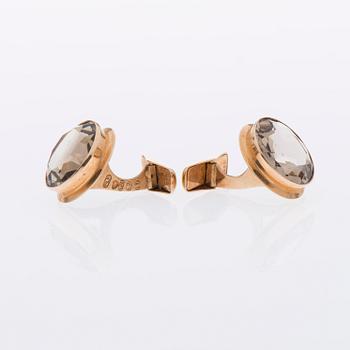 MANSCHETTKNAPPAR, 14K guld, fasettslipade rökkvartser. Peltonen & Kni, Helsingfors 1964.