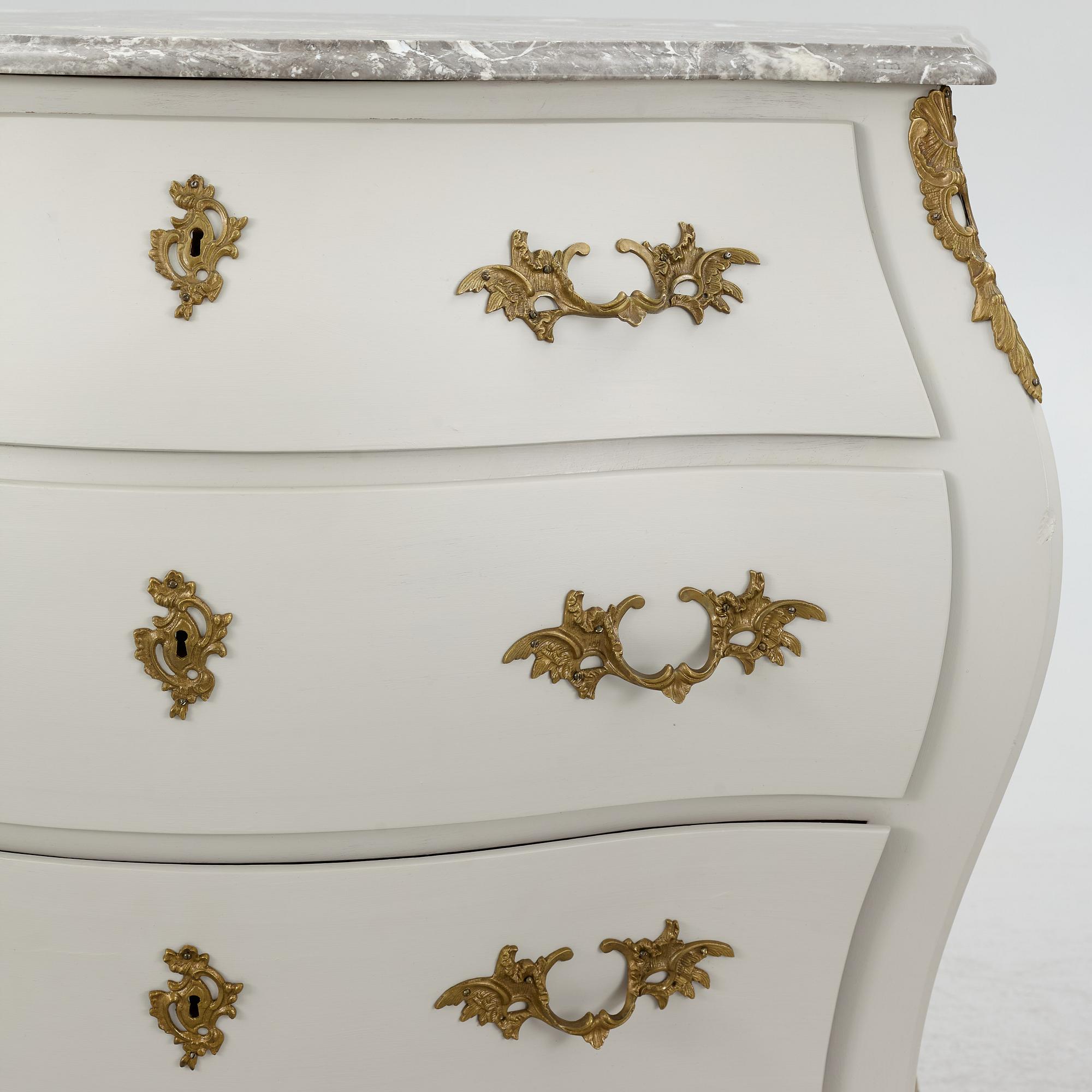 A Rococo style chest of drawers, mid-20th Century.