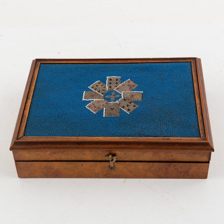 A set of six Chinese ink rubbings, two board games and a box with glass pearl embroidery.