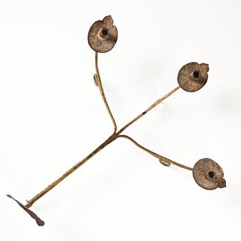 A Swedish wrought iron three-branch wall light, 17th / 18th century.