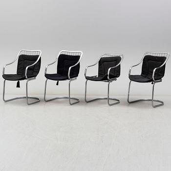 An Italian set of a glass table with four chromed metal chairs, 1970s.