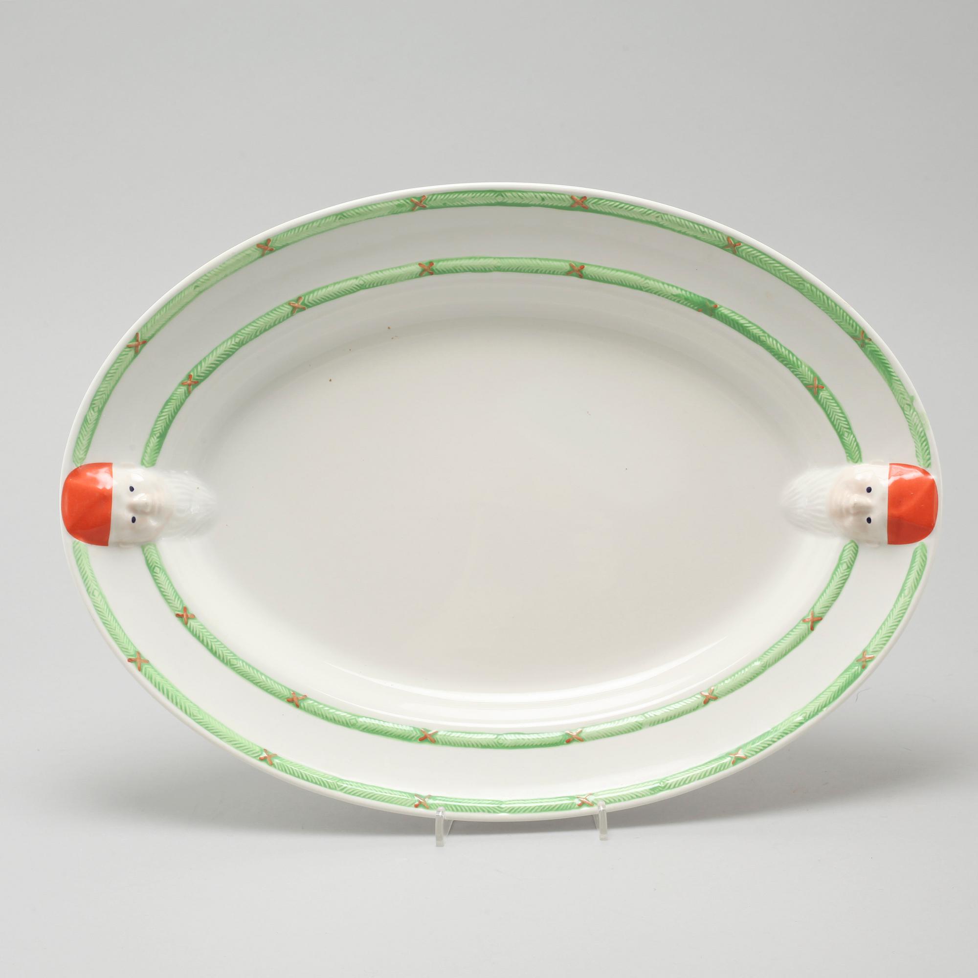 A 20th century set of earthenware tableware of 21 pcs by Gustavsberg.