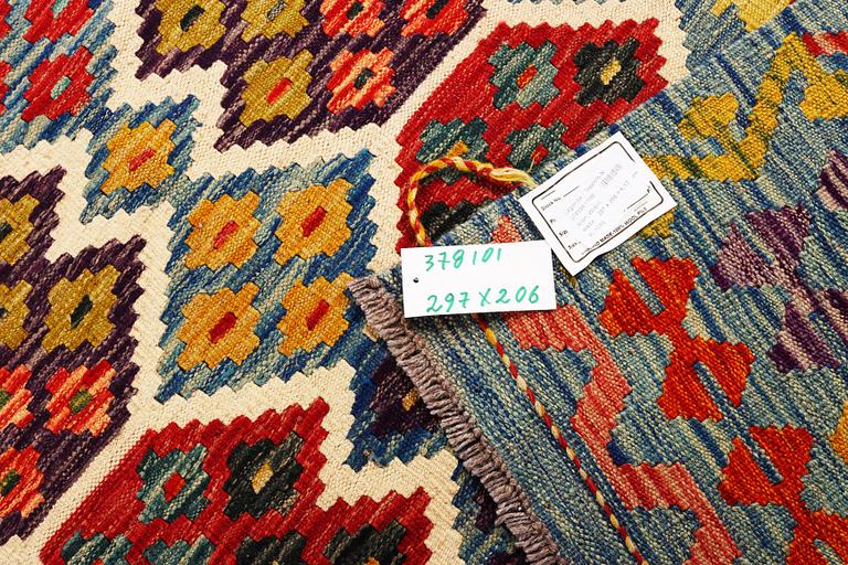 An Afghan Kilim carpet, c. 297 x 206 cm.