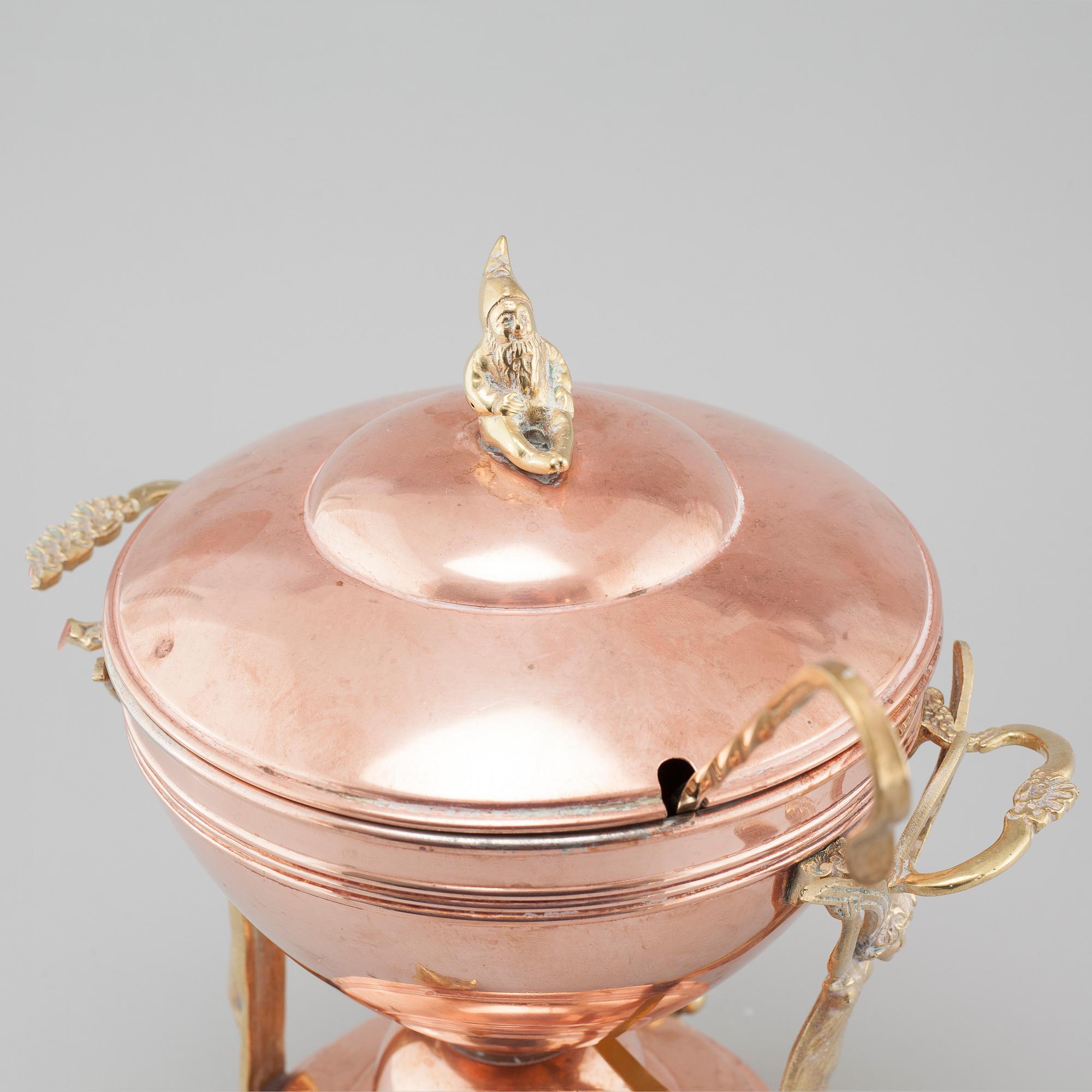 An early 20th century mulled wine heater.