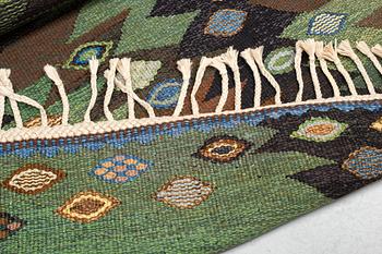 Barbro Nilsson, a carpet, "Tånga brun och grön", flat weave, ca 223 x 153-155 cm, signed AB MMF BN.