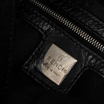 FENDI, a black suede handbag.
