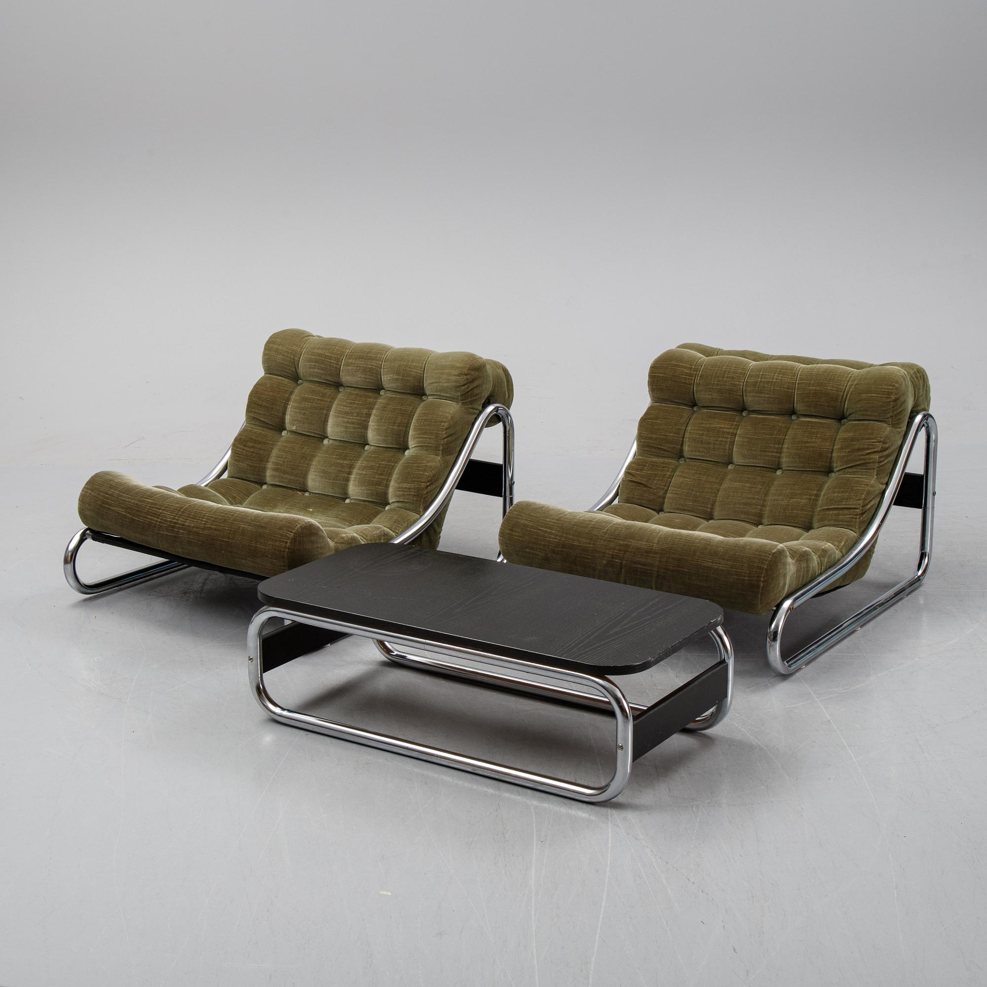 A pair of Impala lounge chairs with table by Gillis Lundgren for IKEA released 1972. Bukowskis