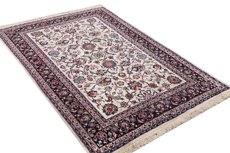 A carpet, Sarouk, part silk, c. 294 x 167 cm.