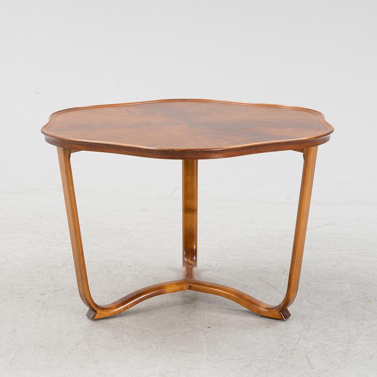 A 1940s mahogany coffee table.