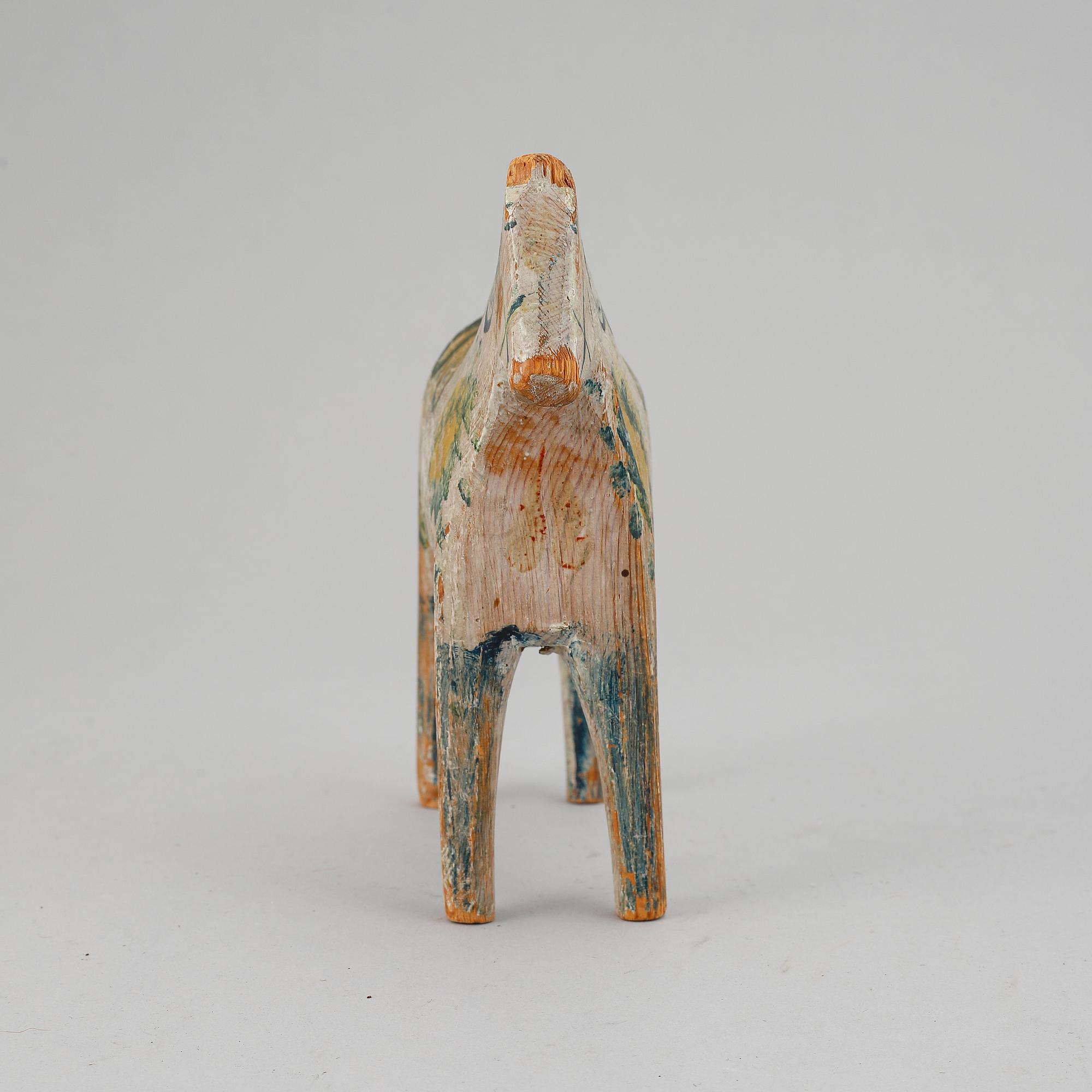 A painted Swedish wooden horse from around year 1900.