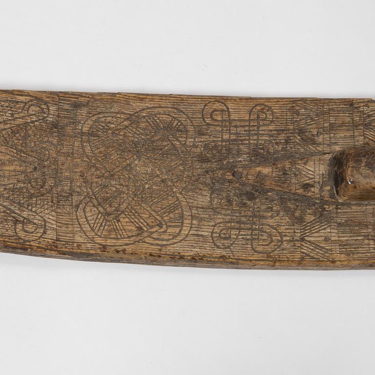 A Swedish folk art mangle board, dated 1666.