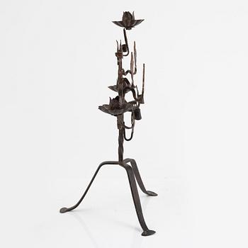 A wrought iron candelabra and a pair of wall sconces, Italy, mid/second half of the 20th century.