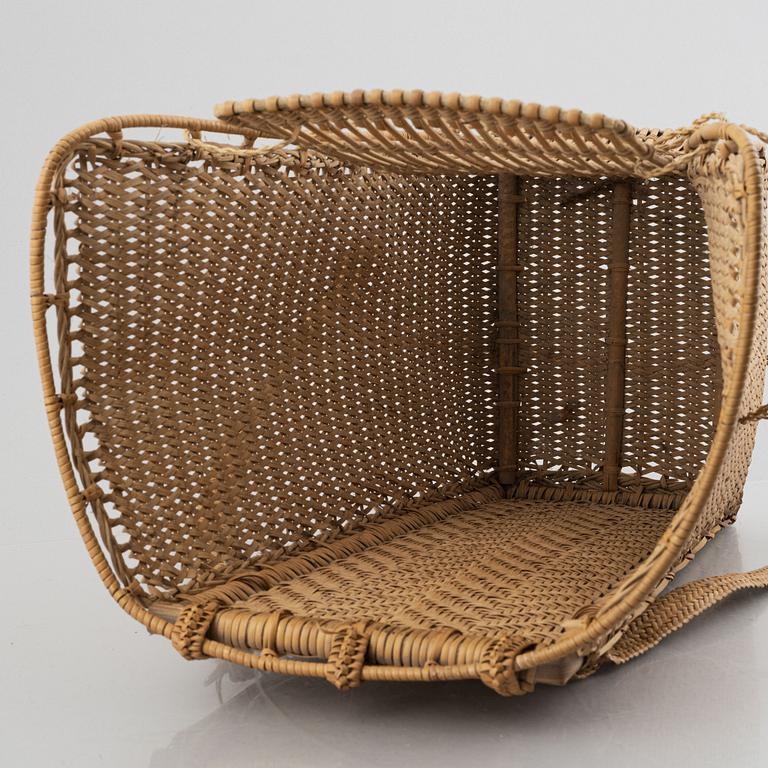 An Indonesian woven rattan backpack, 20th century.