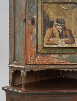 A Swedish polychrome-painted corner cabinet attributed to J. Bäckström (1773-1837).