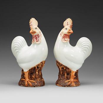 A pair of large white and brown glazed roosters, late Qing dynasty.