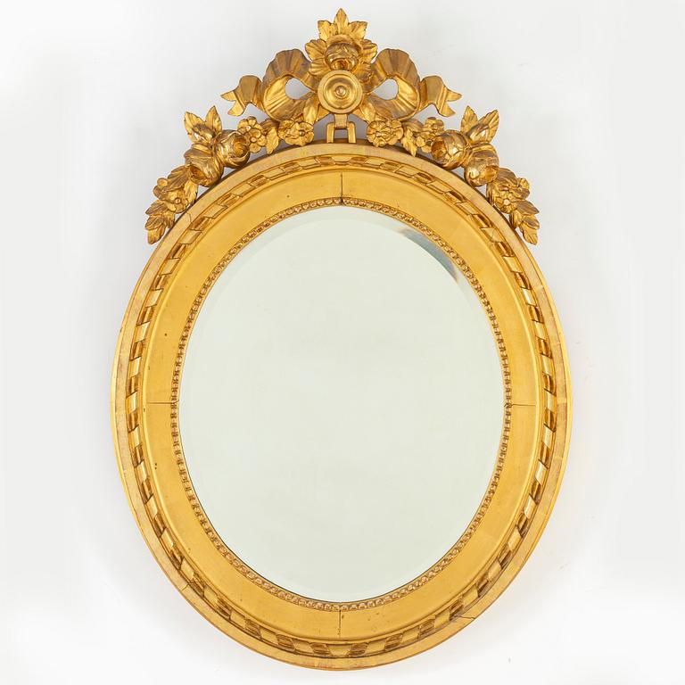 A Gustavian style mirror, mid 20th Century.