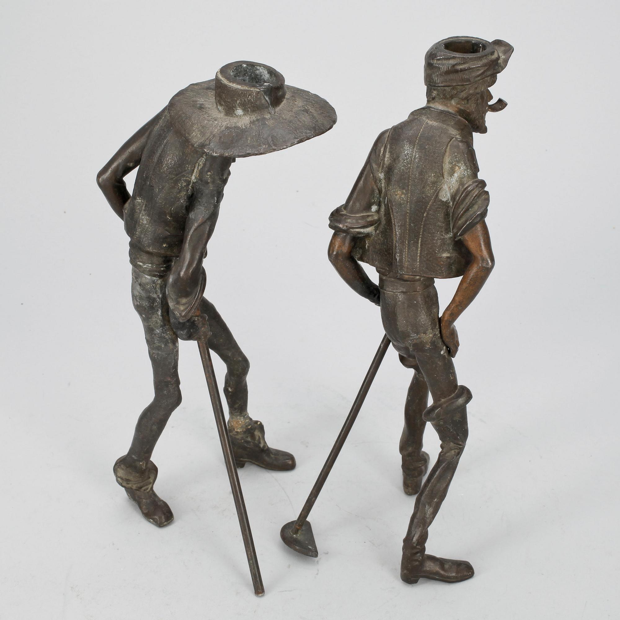 SKULPTUR/LJUSSTAKE, 2 st, patinerad metall, 1800/1900-tal.
