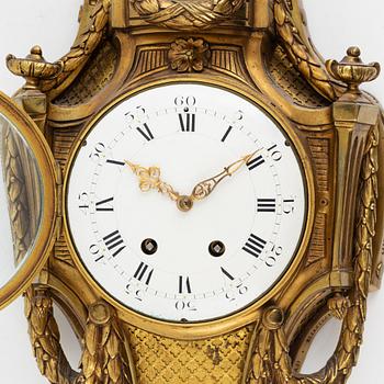 A Louis XVI-style wall clock, early 20th century.