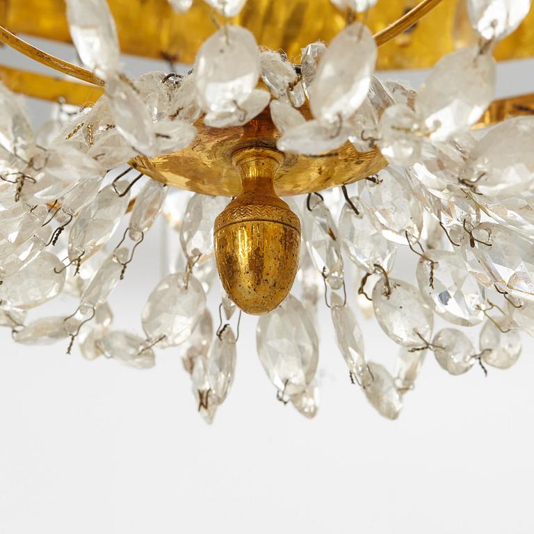 A late Gustavian gilt-brass and cut-glass four-branch chandelier, circa 1800.