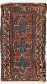 A semi-antique/antique Kazak rug, c. 200 x 120 cm.