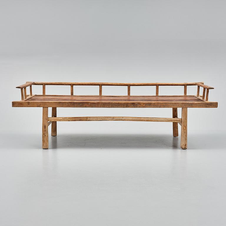 A wooden daybed, South East Asia.