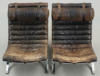 A pair of Arne Norell "Ari" black leather and steel easy chairs by Norell Möbel AB, probably 1960-70's.