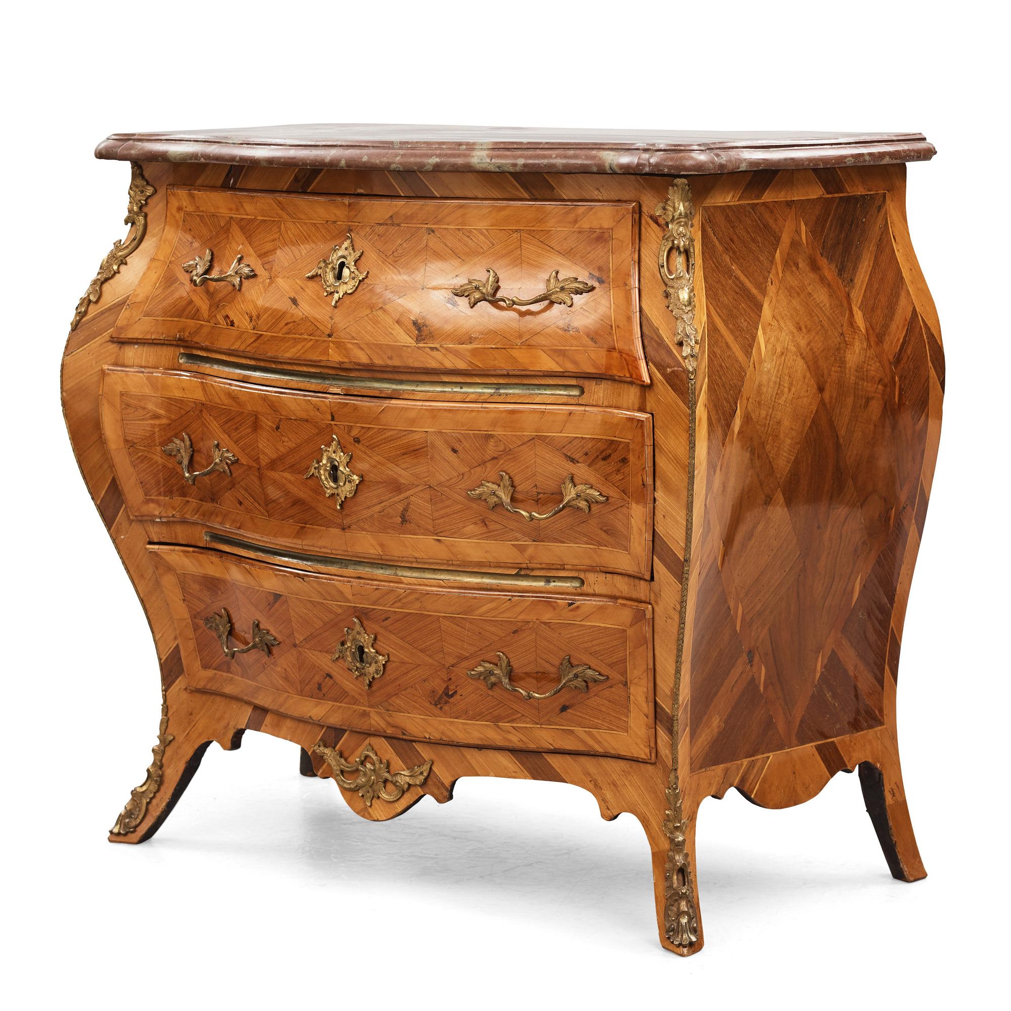 A parquetry and ormolu-mounted rococo commode by P. Gyllenberg (master in Stockholm 1767-85).
