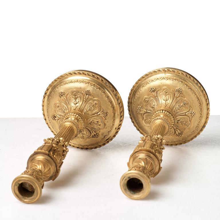 A pair of Louis XVI-style 19th century candlesticks by Raingo Frères, Paris.