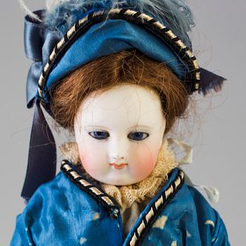 A bisque head fashion doll, probably France, late 19th century.