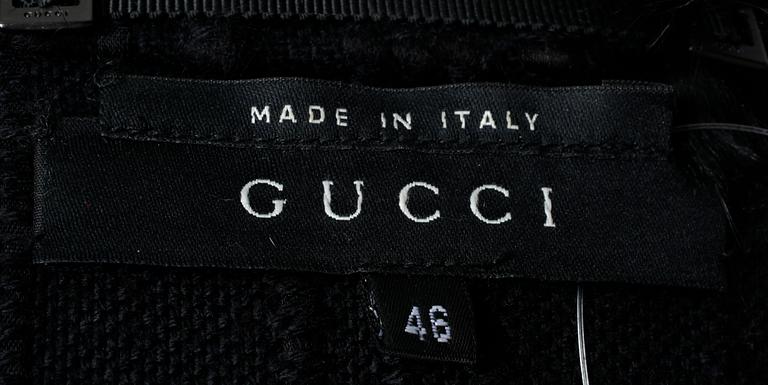 A black coat by Gucci.