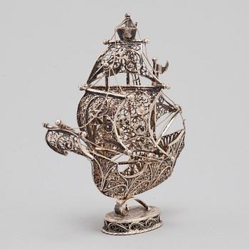 A 20TH CENTURY SILVER MINIATURE SAILING SHIP.