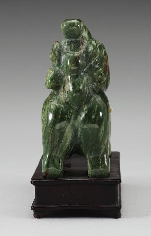 A nephrite figure of a Buddhist Lion, late Qing dynasty.