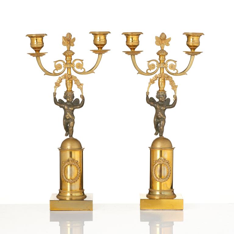 A pair of Empire gilt-brass two-branch candelabra, Stockholm, early 19th century.